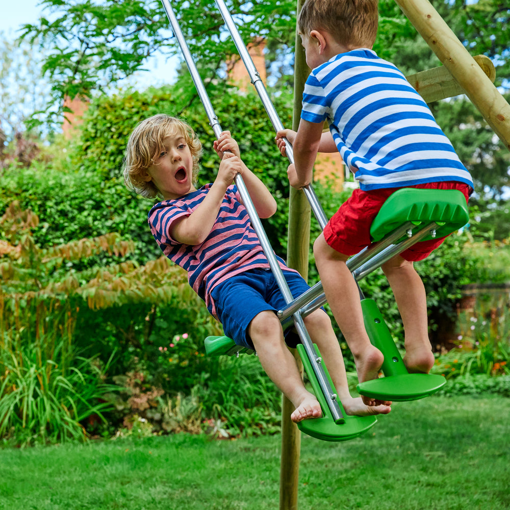 Two boys swinging on duo ride swing seat