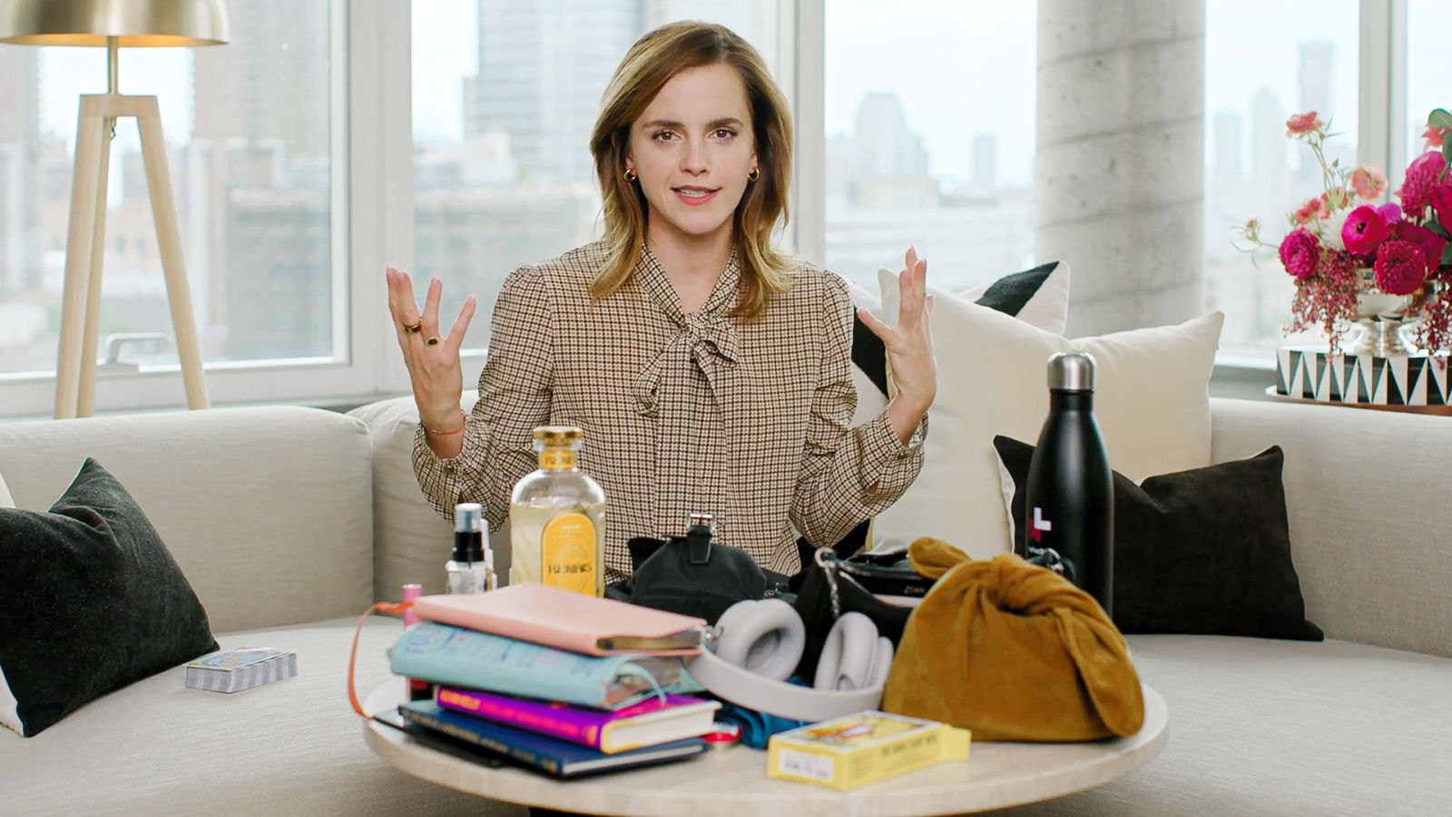 Emma Watson’s Carry-On Bag Is Filled With Items Both Practical and Poetic